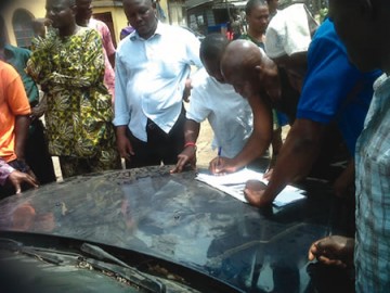 Some of the victims during the registration of their vandalised property